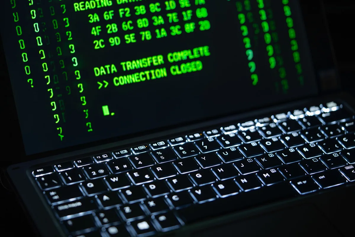 Smartphone displaying a security lock icon on its screen, surrounded by digital padlock symbols and encryption code, representing data protection and secure private access in the deep web.