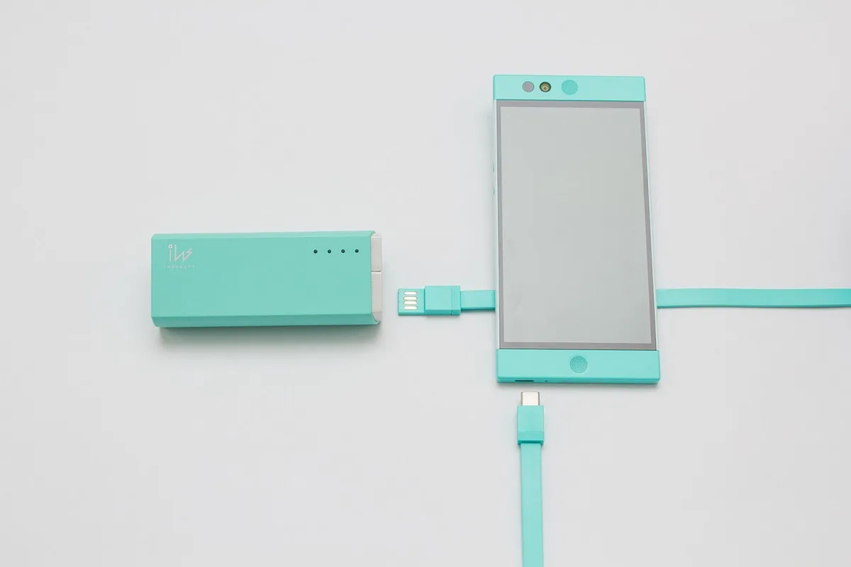 A charging cable connected to a smartphone with a bright battery indicator on screen, emphasizing fast charging capability