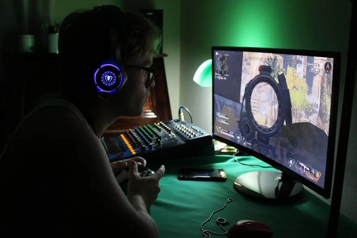 compact mechanical keyboard on desk with glowing keys and no visible brand, angled shot showing keycaps and USB-C cable