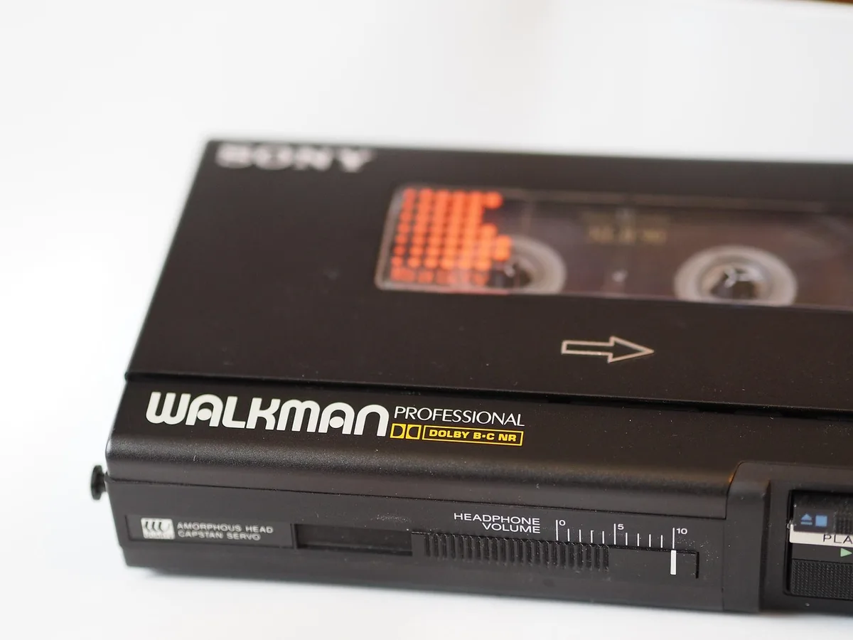 Close shot of a compact music player interface showing album art, anonymous and unbranded